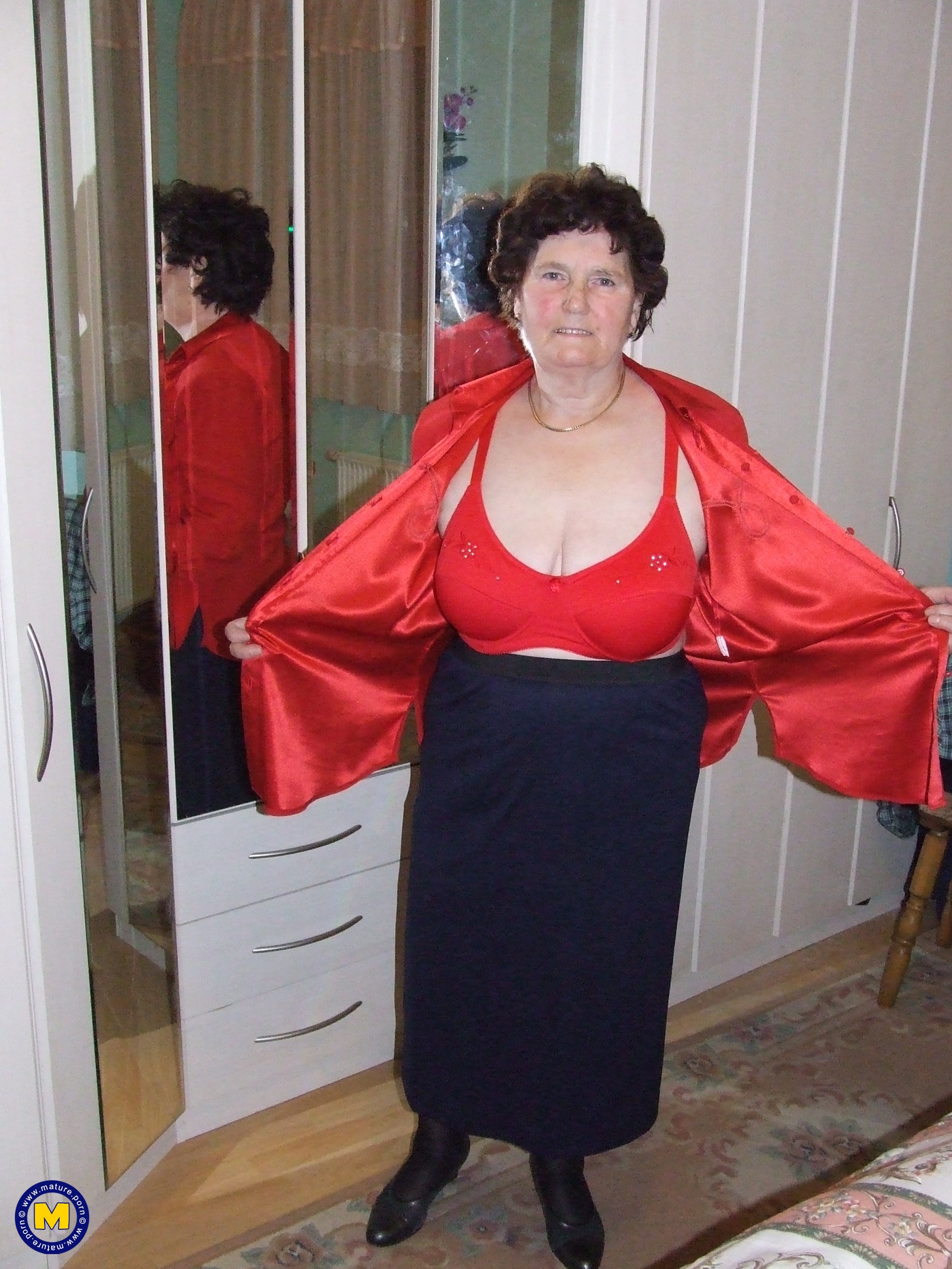 Mature Woman Hildegaard Plays with Her Large Boobs